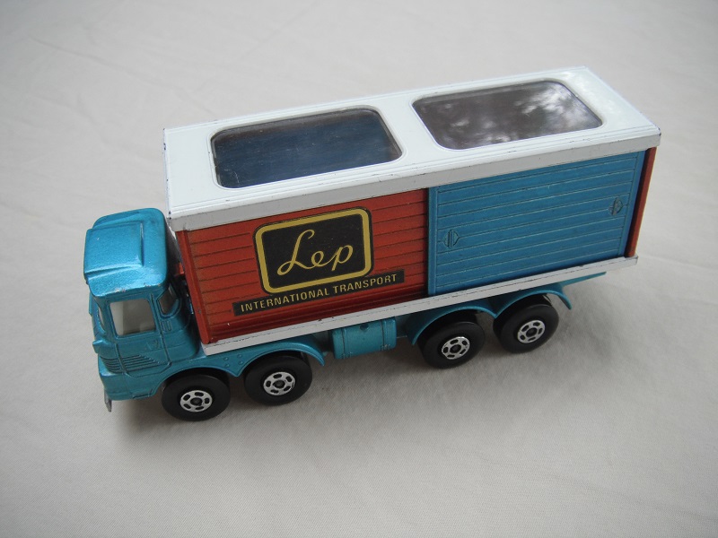 1. PP/ Lt. blu cab/bronze-red container/wht roof/gry base/5 spk star whsl/blk plastic axle cover/LEP