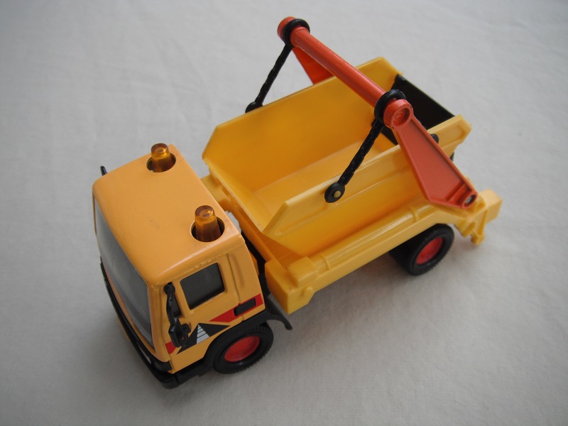 4. Orange-yellow cab/yel skip/ light gry Leyland background/ amber roof light/Road Insignia/black China base.