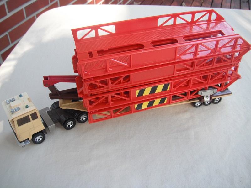 12. Beige cab &amp; brown base (5)/silver fuel tanks/lt.blu lts/amber windows/lt.orange bridge/tan trailer/brown cradle/brown axle cover.