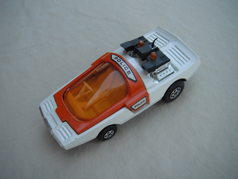 9. White &amp; orange body/matt black base/yellow interior/amber windshield/white steering wheel/amber dome light.