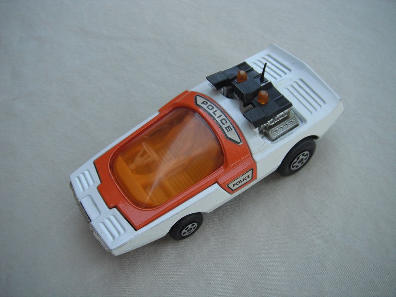 8. White &amp; orange body/matt black base/yellow interior/amber windshield/translucent white steering wheel/amber dome light.