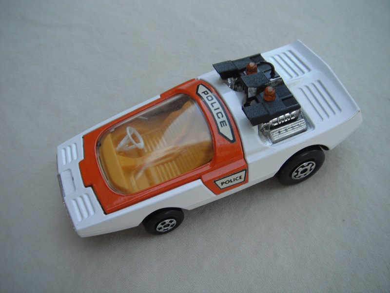 6. White &amp; orange body/matt black base/dk.yellow interior/clear windshield/white steering wheel/amber dome light.