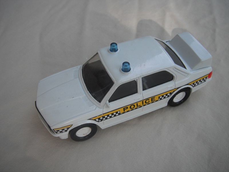 2. White body with checkers/Police/black interior/clear windshield/white Macau base.