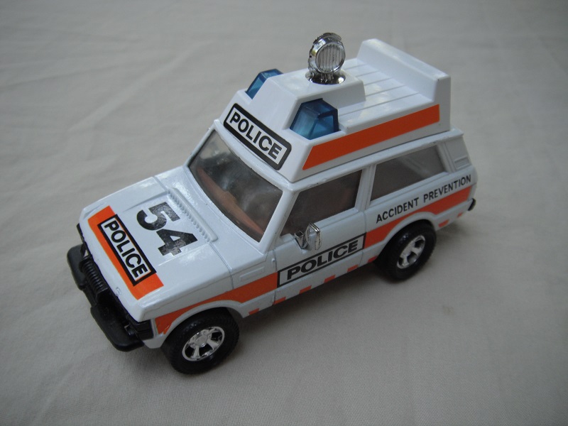 4. White body &amp; roof/gloss black metal base/dark blue roof light/large police decal.