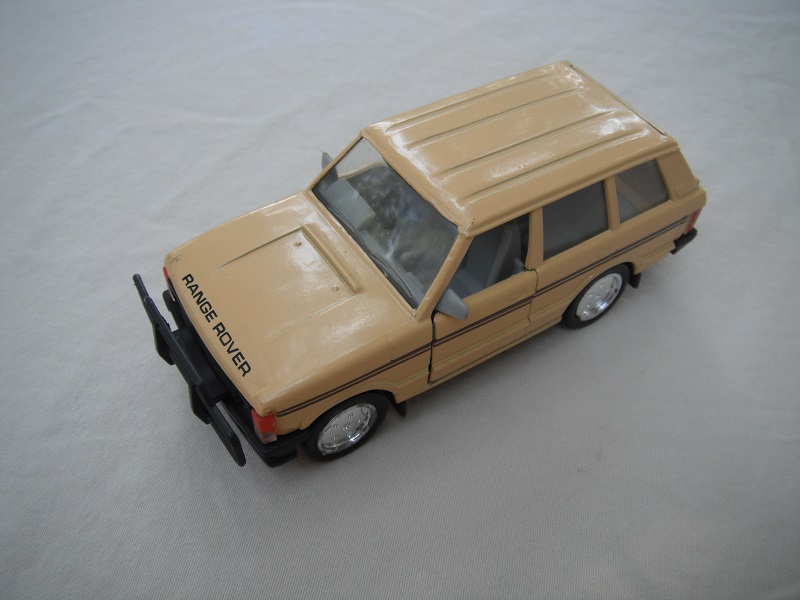 2. Tan body/black plastic base/clear windshield/gray interior/China cast.