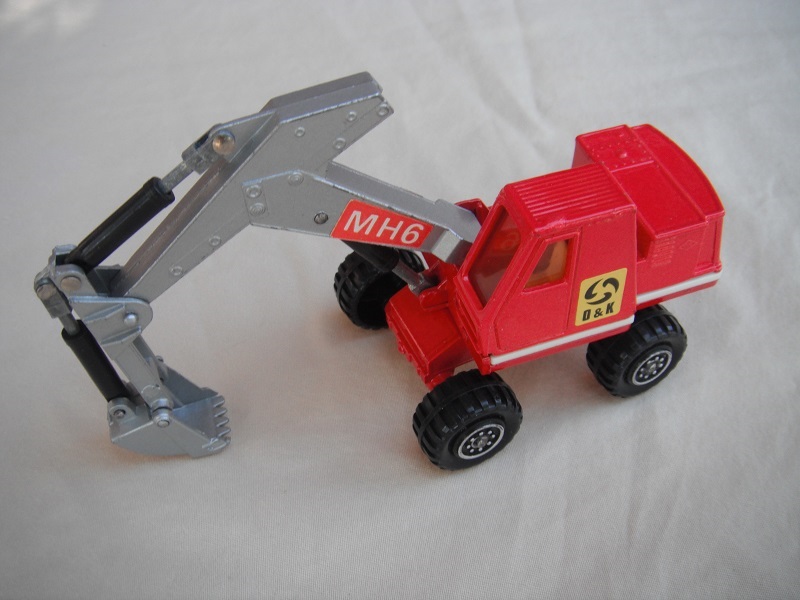 14. Red &amp; silver body/8 dot ringed wheels/silver scoop/amber windows/red MH6 &amp; yellow O&amp;K labels on both sides.