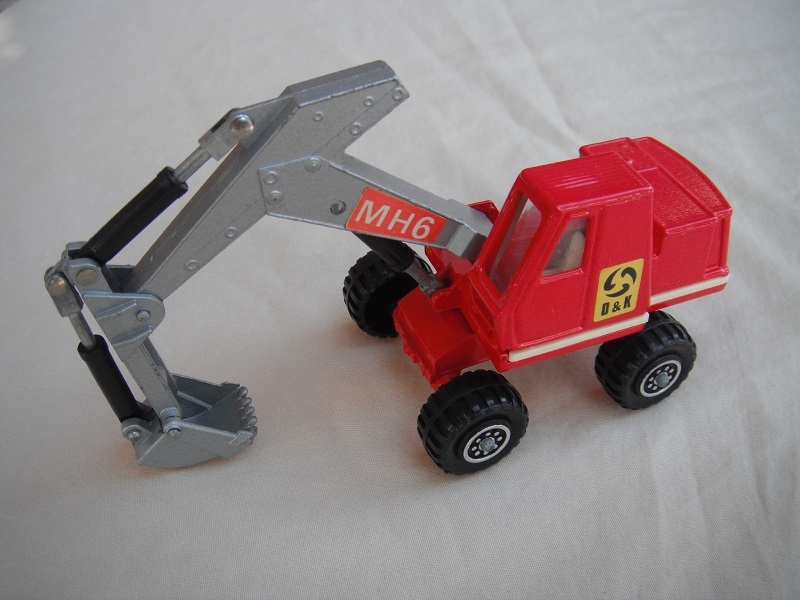 13. Red &amp; silver body/8 dot ringed wheels/silver scoop/clear windows/red MH6 &amp; yellow O&amp;K labels on both sides.