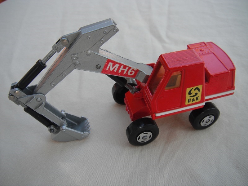 11. Red &amp; silver body/4 spoke wheels/silver scoop/amber windows/dark red MH6 &amp; yellow O&amp;K labels on both sides.