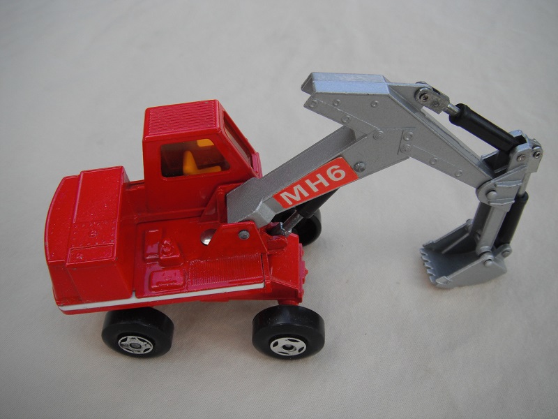 8. Red &amp; silver body/4 spoke wheels/silver scoop/dark amber windows/red MH6 &amp; large red O&amp;K labels on left side only.