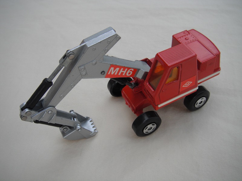 6. Dark red &amp; silver body/4 spoke wheels/silver scoop/amber windows/red MH6 &amp; small red O&amp;K labels on left side only.