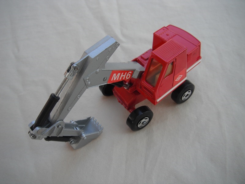 2. Red &amp; silver body/4 spoke wheels/silver scoop/lt. amber windows/red MH6 &amp; small red O&amp;K labels on both sides.
