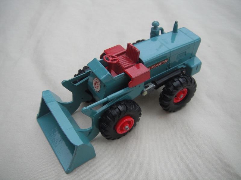 3. Blue/green body/black plastic tires with red hubs/Aveling Barford decals/large front decal/with air filter on side.