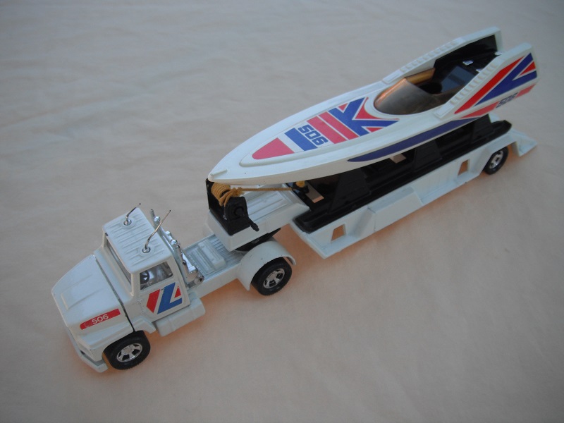 3. White ab &amp; base/clear windshield/antennas on roof/ black axle cover/506/black cradle/small opening/amber boat windshield/black winch/yellow cable/black LH &amp; ring.