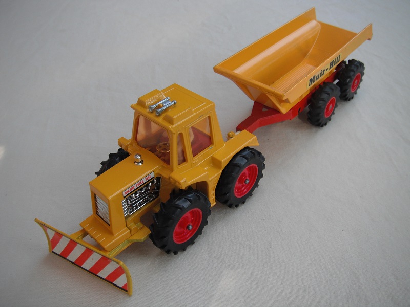 11. Dark yellow tractor/type 2 plow/thick tires/light amber windows/diff type white driver/dark red interior/dark yellow &amp; dark red trailer/large tires/type 1 tow bar/Muir-Hill label.