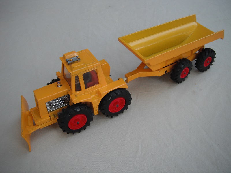 1. PP/Dark yellow tractor/no stripes on plow/thick tires/clear windows/blue driver/dark red interior/light yellow trailer/large tires/type 1 tow bar/no label.