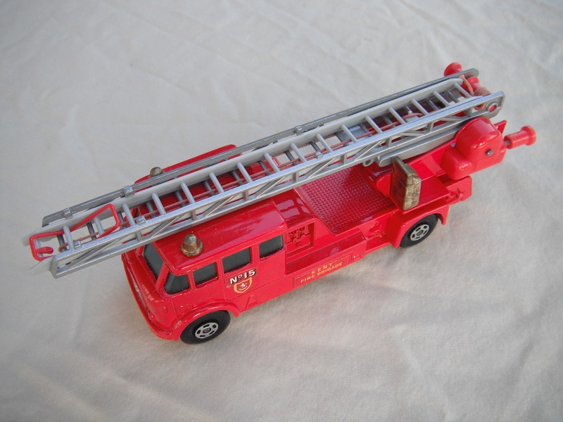 13. Bright red body/silver base/5 spoke wheels/tow guide/KFB rectangular labels/gold controller/MX series with red plastic parts.