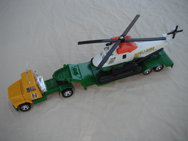 3. Yellow cab/green Mbx.base/clr windows/white circle on trailer/no holes/white&amp;green helo w/dk.orange engines/clear windows.dk.green labels.
