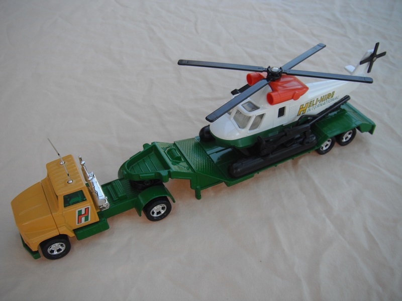 1. Dk.yellow cab/green Mbx.base/grn windows/white circle on trailer/no holes/white&amp;green helo w/dk.orange engines/clear windows/dk.green lables.