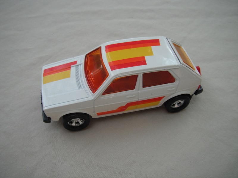 10. White body/red interior/amber windshield/5 spoke mag wheels/stripes/England casting.