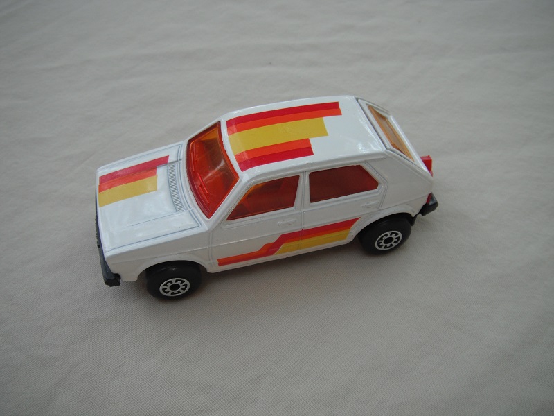 9. White body/red interior/amber windshield/5 arch wheels/stripes/England casting.