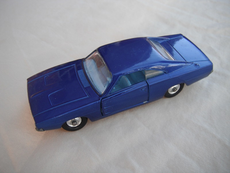 6. Very dark blue body/unpainted base/clear windows/light blue interior/black plastic tires with chrome hubs.