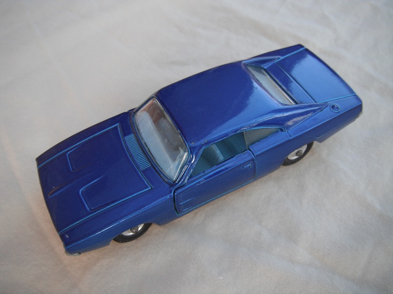 5. Dark blue body/unpainted base/clear windows/pale blue interior/black plastic tires with chrome hubs.