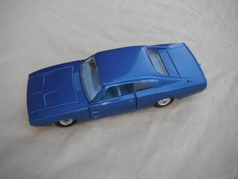 4. Dark blue body/unpainted base/clear windows/light blue interior/black plastic tires with chrome hubs.