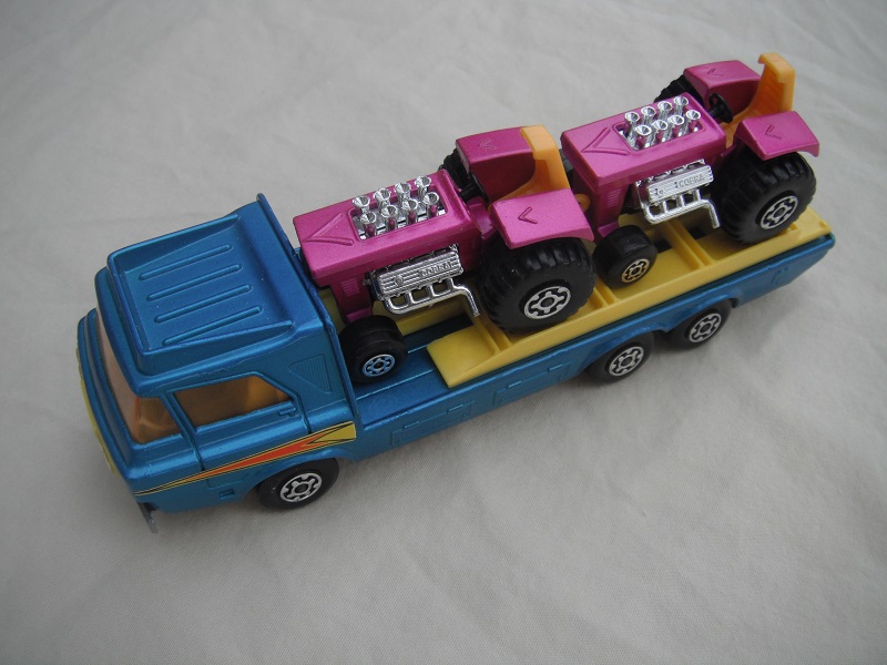 2.  Blue body/silver-gray base/yellow interior/amber windshield/yellow loading ramp.