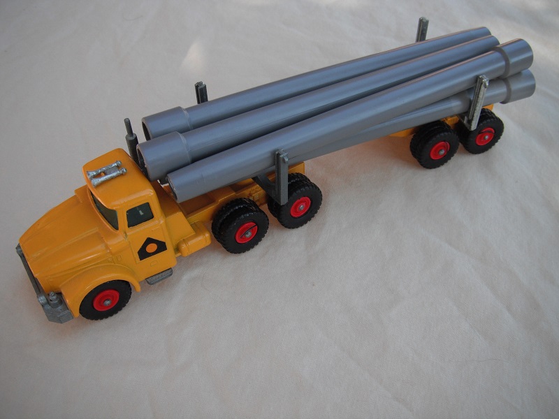 3. Dark yellow cab &amp; trailer/unpainted type 2 base/clear plastic insert/black plastic tires/square hook/dark gray pipes.