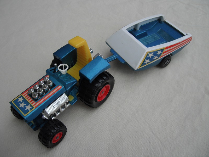 16. Metallic blue body/dark yellow seat/yellow radiator &amp; gas pedal/metallic blue &amp; white trailer/blue stars &amp; red stripes label/5 spoke wheels.