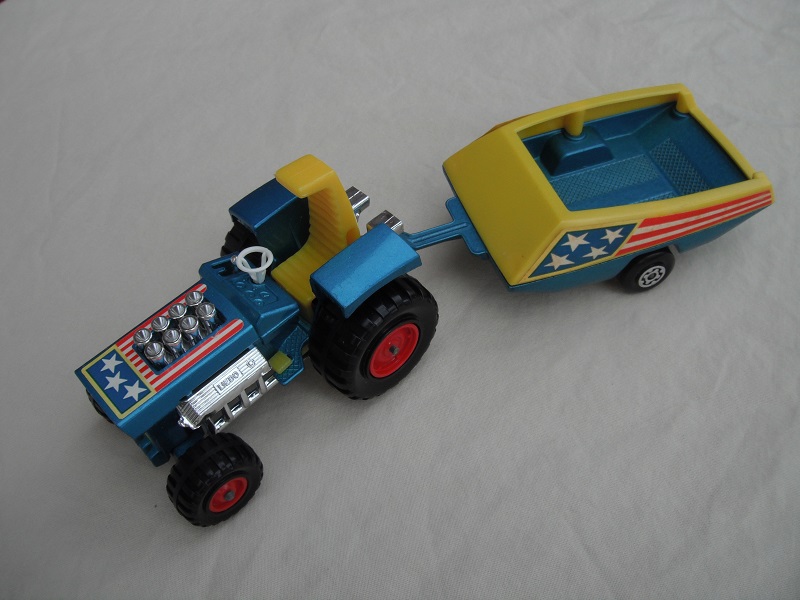 10. Met.blue body/dark yellow seat/dark yellow radiator &amp; gas pedal/metallic blue &amp; yellow trailer/blue stars &amp; red stripes label/Maltese cross wheels.