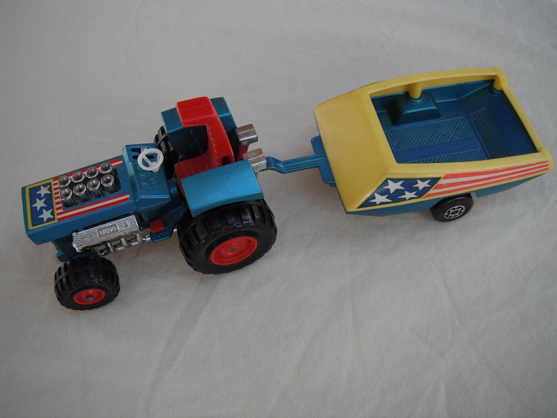 3. Metallic blue body/red seat/red radiator &amp; gas pedal/metallic blue &amp; dark yellow trailer/dark blue stars &amp; red stripes label/Maltese cross wheels.