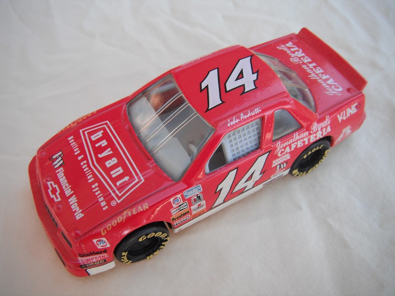 5. Red body w/various racing logos/black China base/gray int/clear windows/Goodyear in dark yellow on wheels/&quot;Bryant Cafeteria&quot; &amp; &quot;14&quot;.