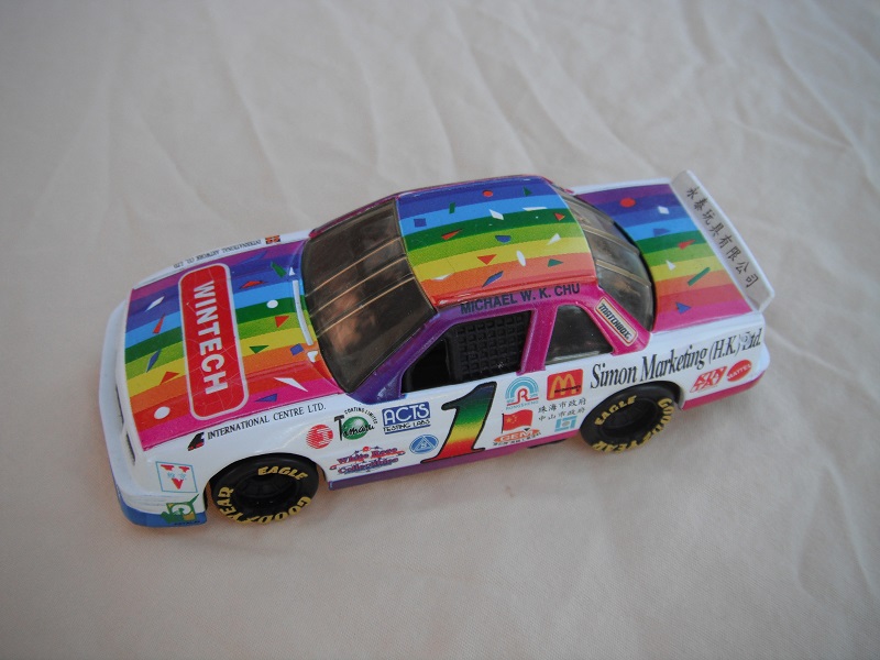 1. PP/ White body w/colored stripes/black base no origin/black int/clear windows/Goodyear Eagle in yellow on wheels/no inscription on base/&quot;Wintech&quot; &amp; &quot;1&quot;.