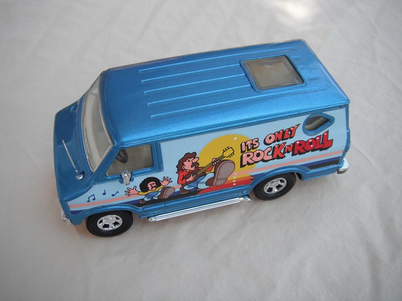 3. Metallic blue body/black base/clear windshield with chrome outline/cream interior/Its only Rock &amp; Roll.