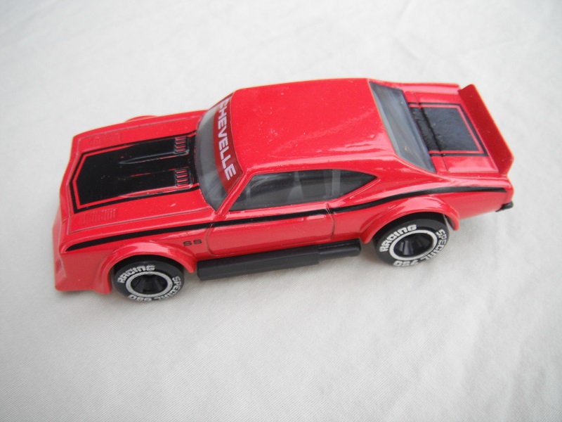 13. Red body with black stripe/black base China/dark gray interior/clear windows/chromed lettering on wheels/SS.