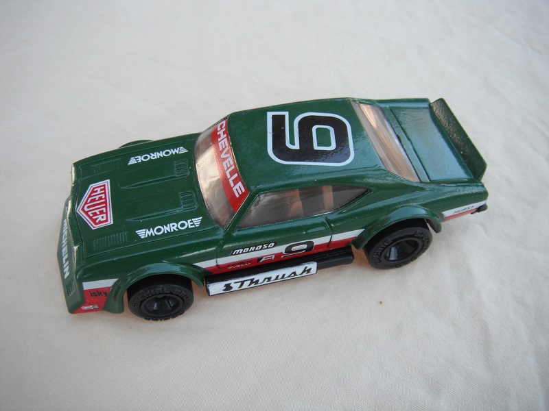3. Green body with white &amp; red stripes/black base China/brown interior/clear windows/black wheels/Moroso #9.