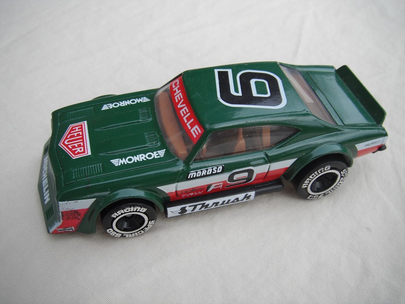1. Green body with white &amp; red stripes/black base Macau/brown interior/clear windows/chromed lettering on wheels/Moroso #9.