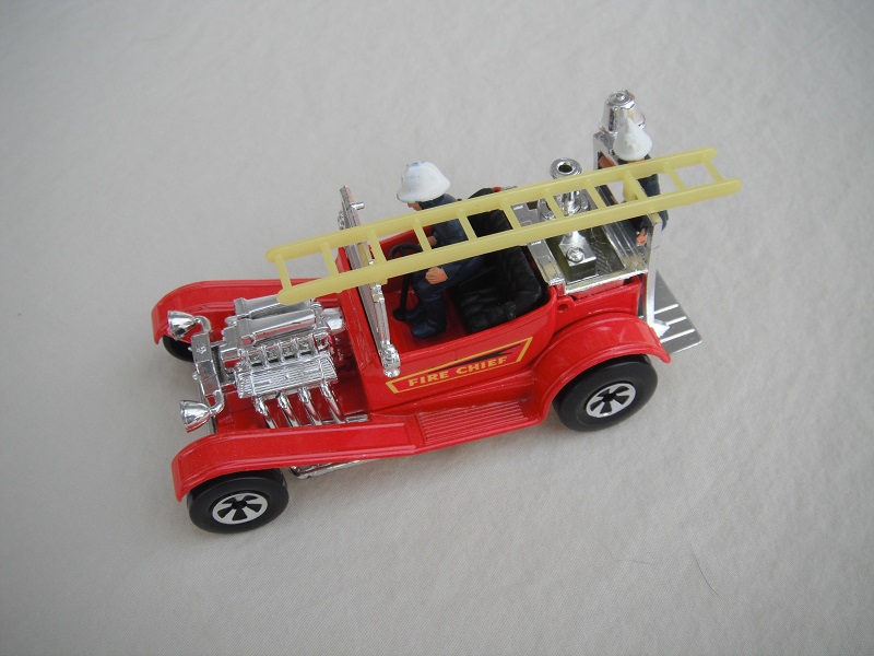 8. Red body/K50-53 Speedkings base/lemon yellow ladder/'Fire Chief' labels/dark blue firemen with exposed flesh &amp; white helmets.