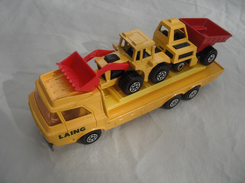 6b. Dark yellow body/silver base/yellow interior/amber windshield/light yellow loading ramp/&quot;Laing&quot; label on cab/MB26 &amp; MB29 in yellow &amp; red.