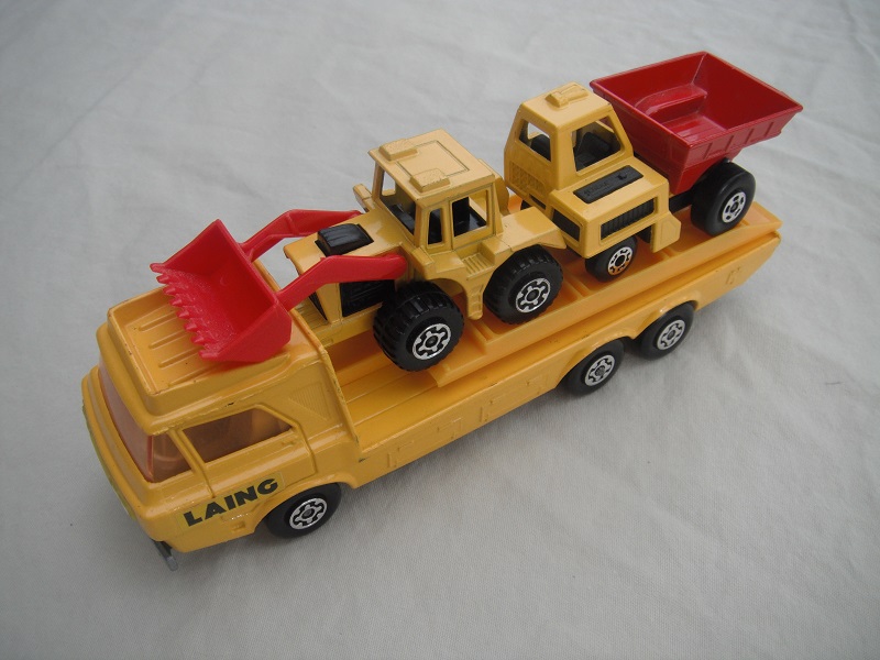 6a. Dark yellow body/silver base/yellow interior/amber windshield/yellow loading ramp/&quot;Laing&quot; label on cab/MB26 &amp; MB29 in yellow &amp; red.