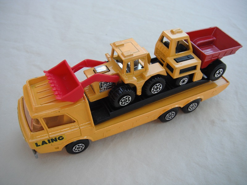 5. Dark yellow body/silver base/yellow interior/light amber windshield/black loading ramp/&quot;Laing&quot; label on cab/MB26 &amp; MB29 in yellow &amp; red.