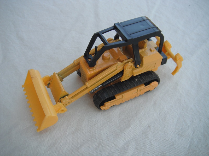 8. Dark yellow body/type 2/dk.yellow plastic base/no country of origin/K42-2/black canopy/dk. yellow plastic bucket &amp; ripper/no labels/no driver.