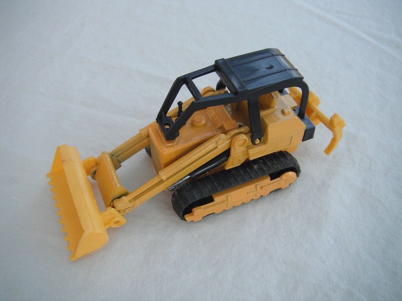 7. Yellow body/type 2/yellow plastic base/no country of origin/K42-2/black canopy/dk. yellow plastic bucket &amp; ripper/no labels/no driver.