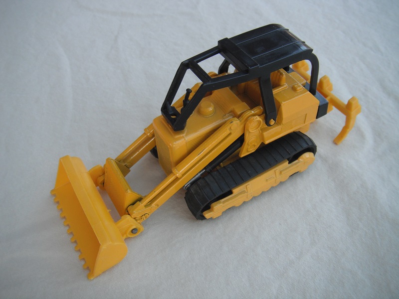 5. Yellow body/type 1/dk.yellow England plastic base/K42-2/black canopy/yellow plastic bucket &amp; ripper/no labels/no driver.