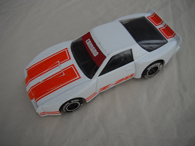 13. White body with orange stripes/black base China/black interior/chrome lettering on wheels/Camaro Z-28.