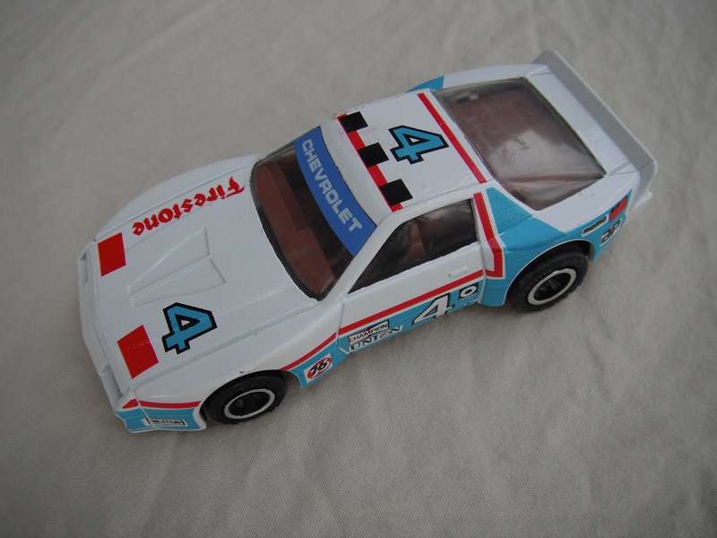 4. White body with blue &amp; red stripes/black base Macau/brown interior/black wheels/pullback motor/Firestone #4.