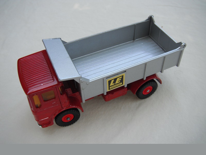 8. Red cab/silver tipper/silver base/black plastic tires/amber windows/silver grill &amp; bumper/LE label/in #3 tailgate.