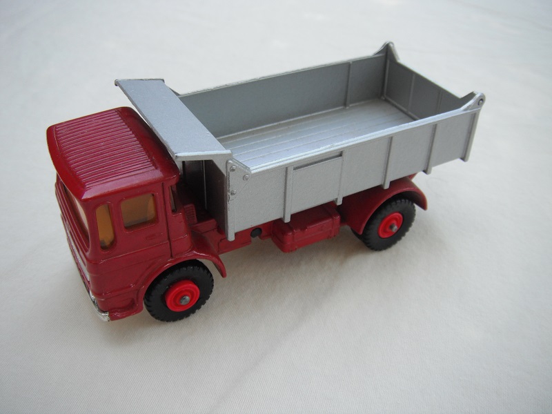 6. Dark red cab/silver tipper/silver base/black plastic tires/amber windows/silver grill &amp; bumper/no label/out #1 tailgate.