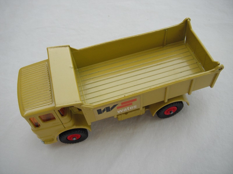 2. Lime green cab &amp; tipper/silver base/black plastic tires/amber windows/silver grill &amp; bumper/W.Wates label/out #3 tailgate.